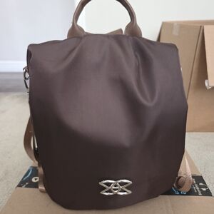 Elegant Brown Backpack with Silver Detail